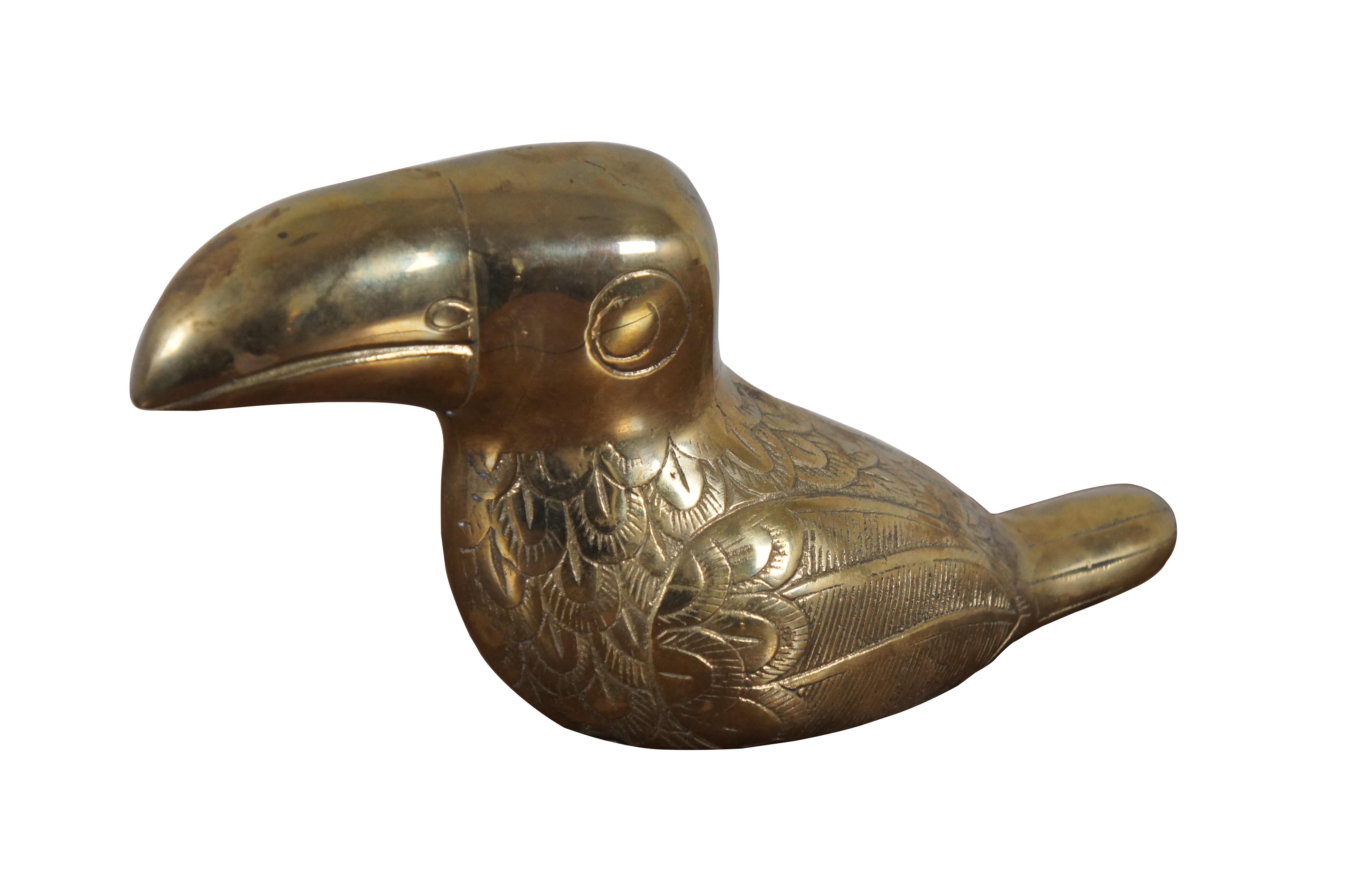 Vintage brass and copper figurine / sculpture in the shape of a toucan / parrot / bird, by Dolbi Cashier for Castilian Imports. Made in Korea.

Dimensions:
11