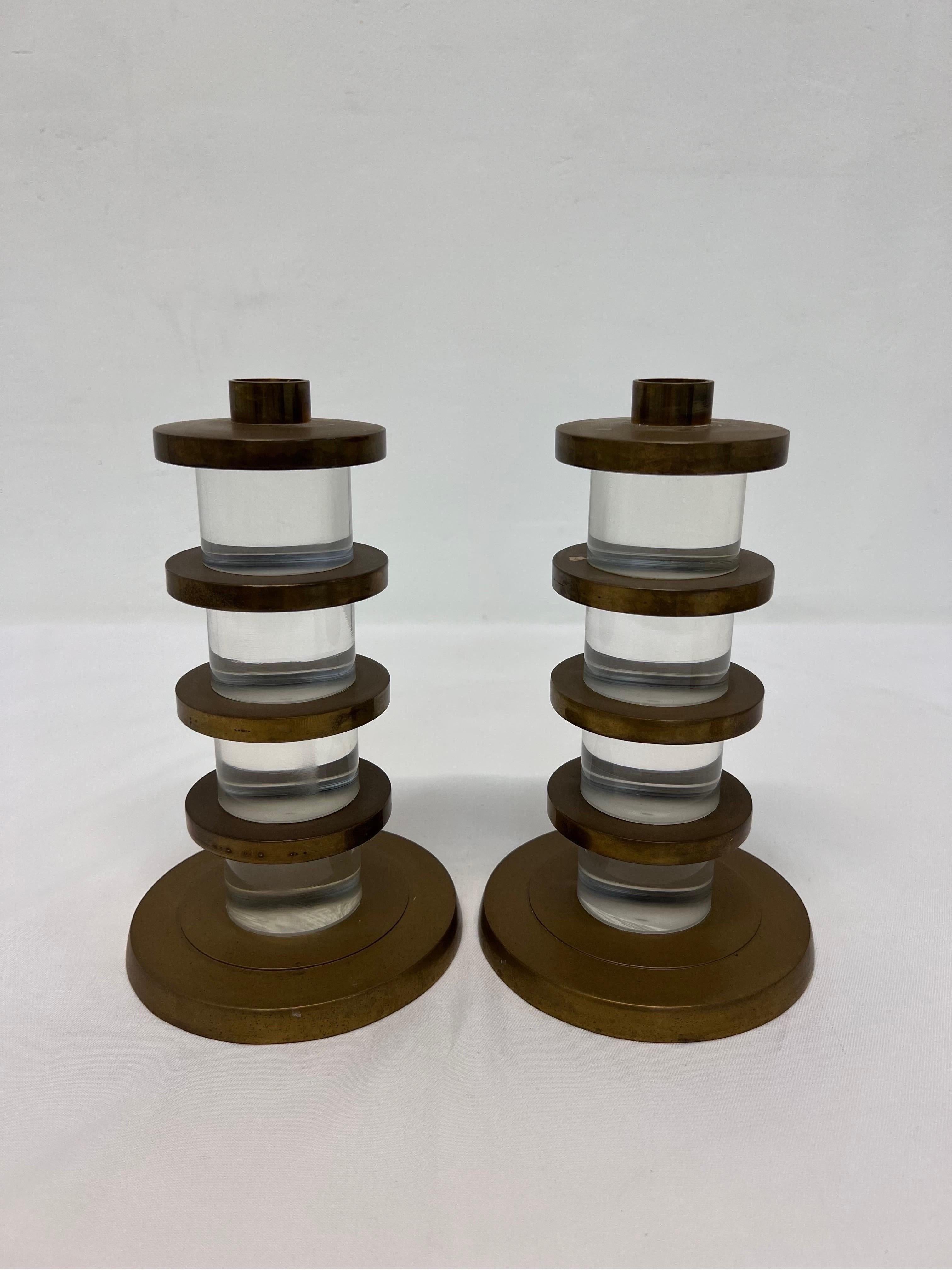 Pair of Dolby Cashier lucite and patinated brass candle stick holders, 1987.
