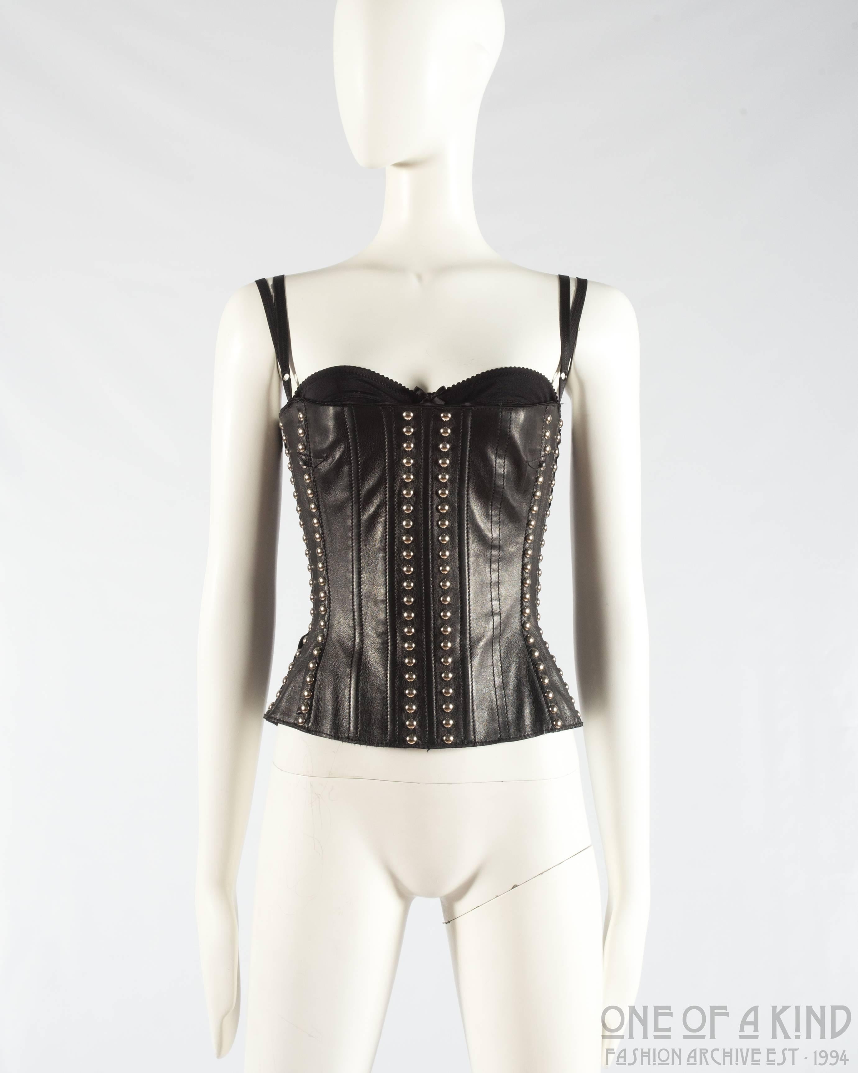Dolce & Gabbana black leather corset with silver studs 

- internal bra with adjustable straps 
- boned corset 
- silver metal zip closure on centre back

Spring-Summer 2000