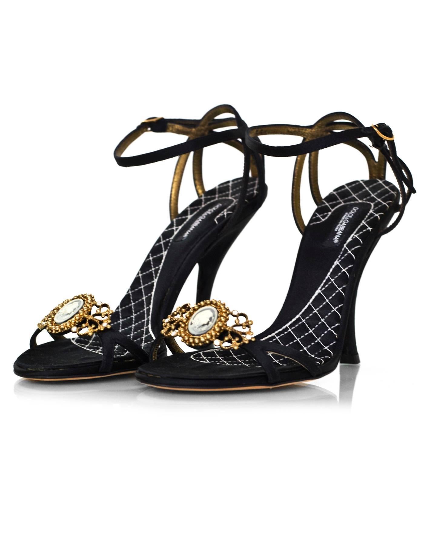 Dolce & Gabbana Black Satin Cameo Sandals Sz 35.5

Made In: Italy
Color: Black
Materials: Satin, metal, crystal
Closure/Opening: Buckle closure at ankle
Sole Stamp: DG Vero Cuoio Made in Italy 35.5
Overall Condition: Excellent pre-owned condition