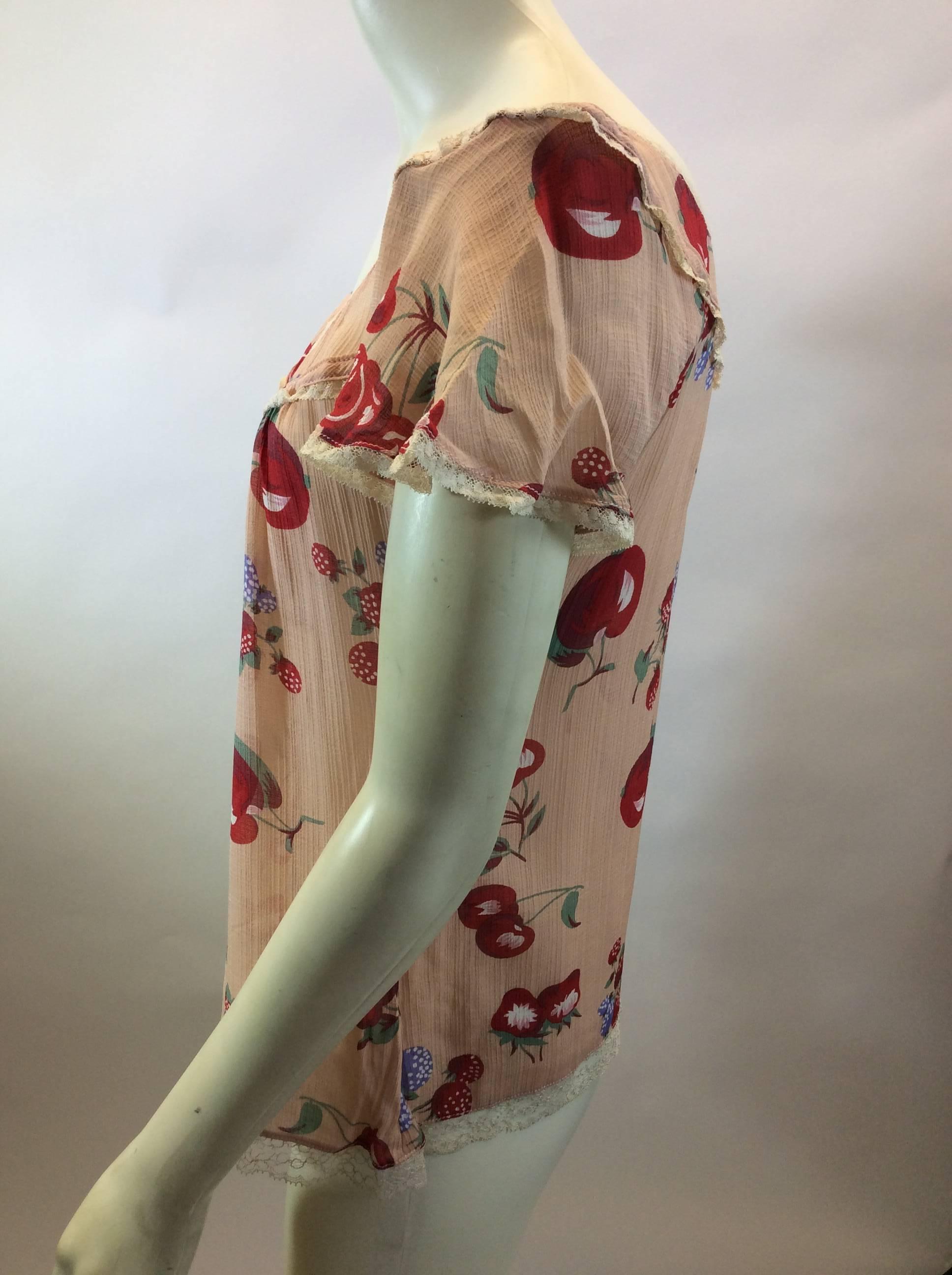 Dolce & Gabbana Cherry Print Silk Blouse
$85
100% Silk
Made in Italy
Size 40
Length 23