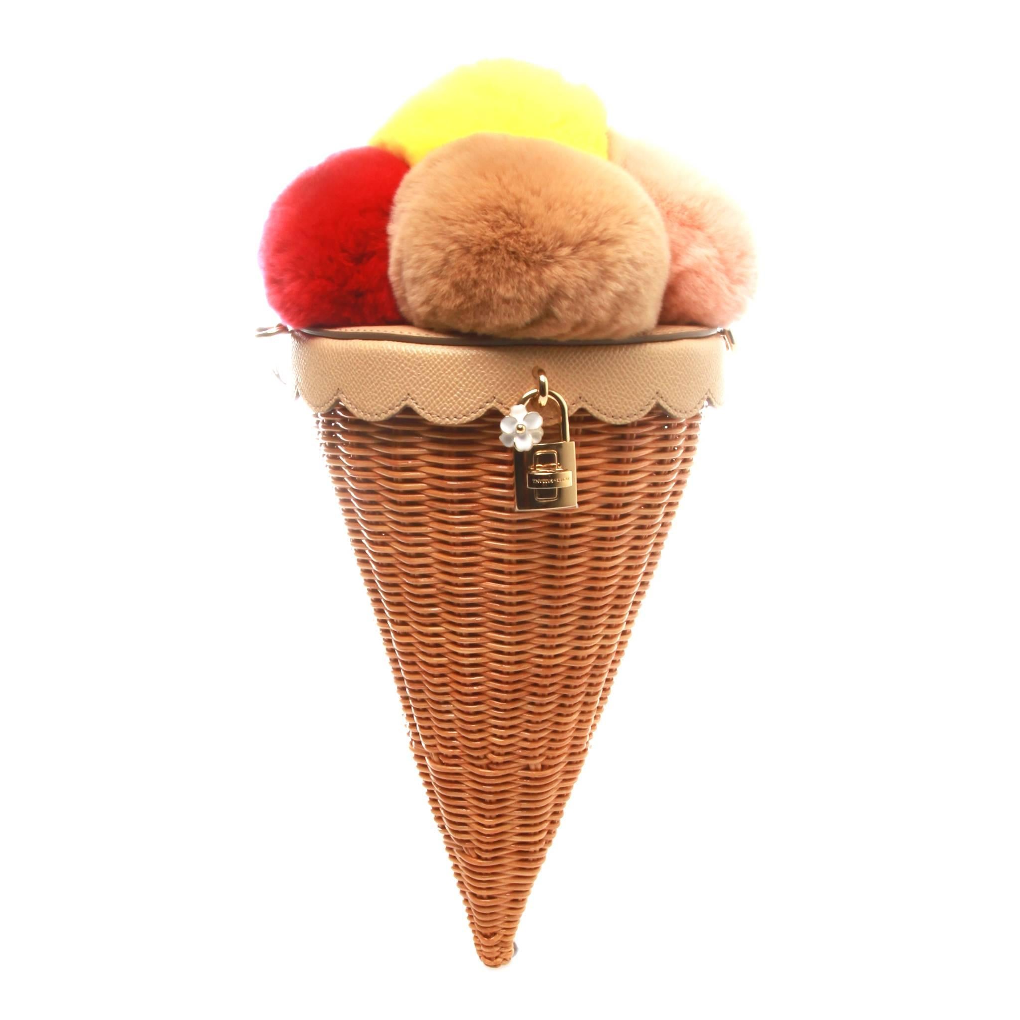 Multicolour ice cream cone bag from Dolce & Gabbana featuring a gold-tone twist lock fastening, a woven design and an adjustable shoulder strap.

Strap 55cm

Outer Composition: Rabbit Fur 40%
Outer Composition: Calf Leather 10%
Outer Composition: