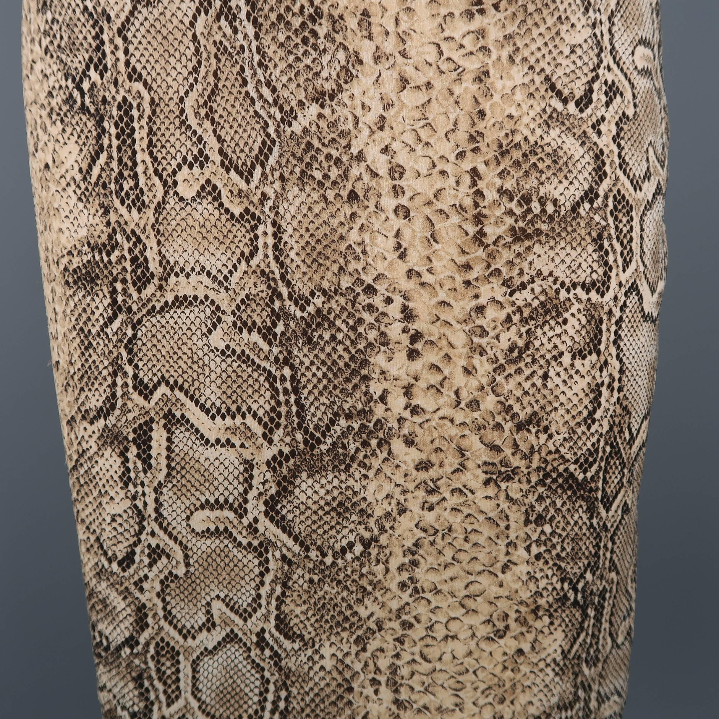 Archive DOLCE & GABBANA pencil skirt comes in python snake print silk chiffon with tan satin liner and hidden back zip closure. Hook eye closure missing from back. Tag cut.  As-is. Made in Italy.
 
Good Pre-Owned Condition.
Marked: (no tag)
