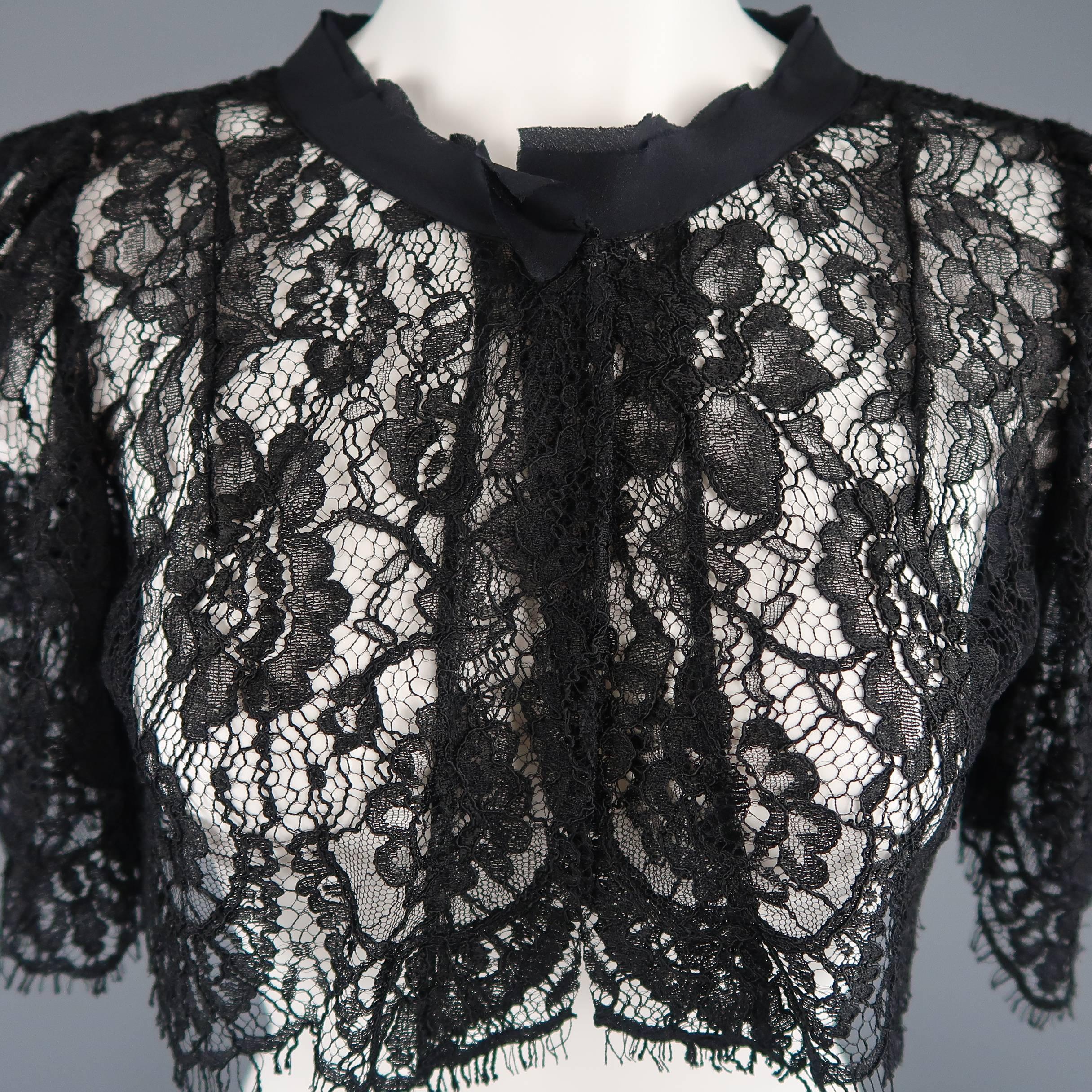 DOLCE & GABBANA bolero capelet comes in floral lace with a raw edge chiffon stand up trim collar, single snap closure, and short puff sleeves. Care tag cut out. Made in Italy.
 
Good Pre-Owned Condition.
Marked: IT 42
 
Measurements:
 
Shoulder: