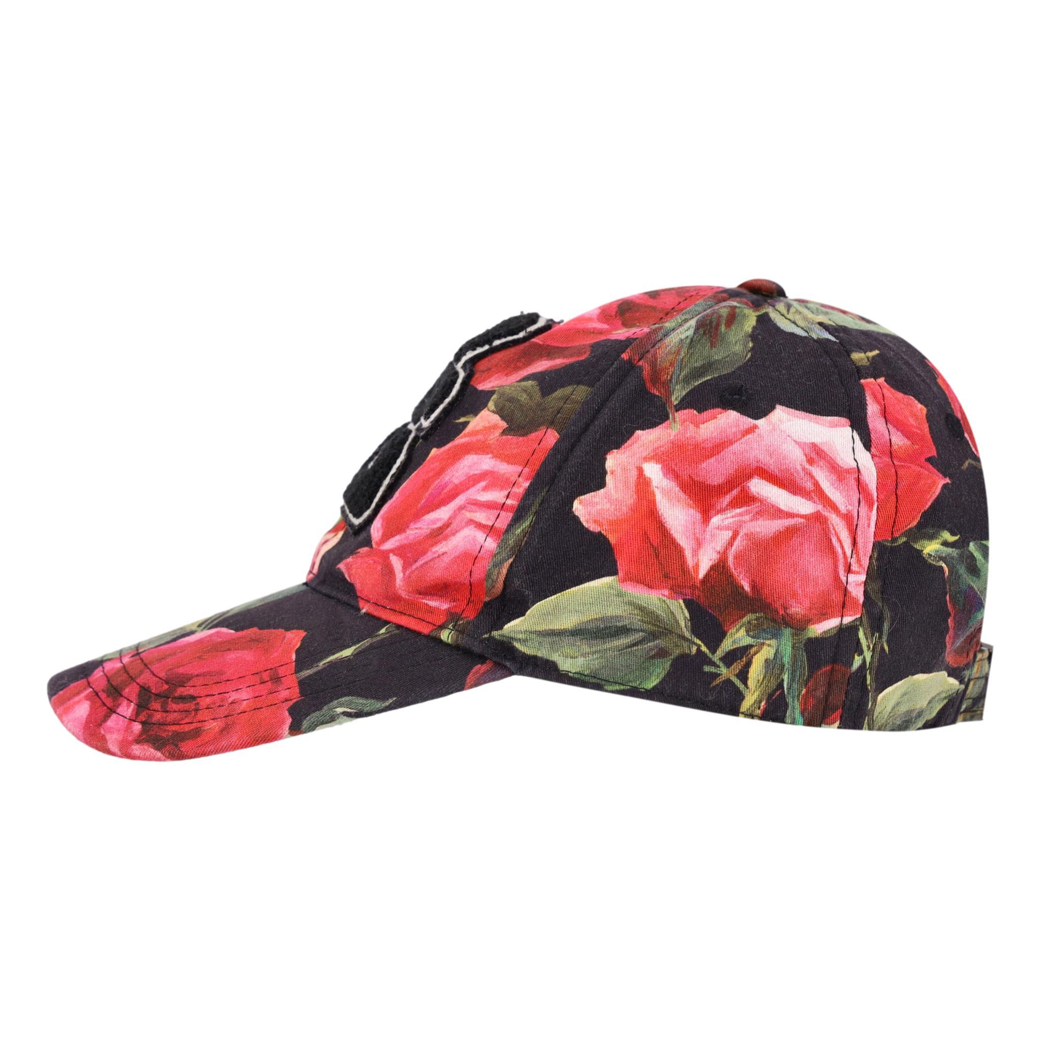 Dolce & Gabbana Rose Print 'DG' Logo Baseball Cap

Black cap designed with rose print in red and green.

Detailed with black 'DG' logo to the front and adjustable, 'Dolce & Gabbana' logo engraved buckle to rear.

Featuring gros-grain interior