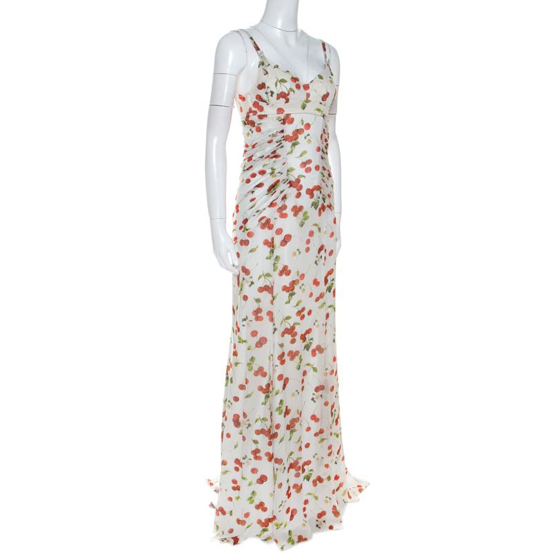 This dreamy Dolce & Gabbana dress will make you feel like a diva. It is a great option for evenings and special occasions. Crafted from silk and other quality materials, it comes in a lovely shade of white and features cherry print throughout. This