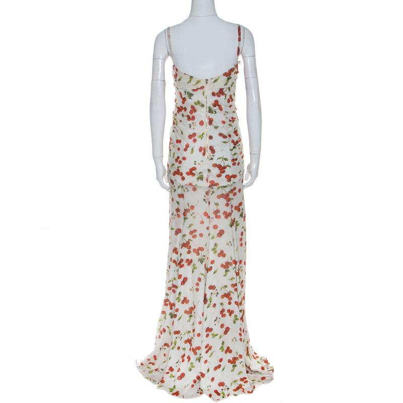 This dreamy Dolce & Gabbana dress will make you feel like a diva. It is a great option for evenings and special occasions. Crafted from silk and other quality materials, it comes in a lovely shade of white and features cherry print throughout. This