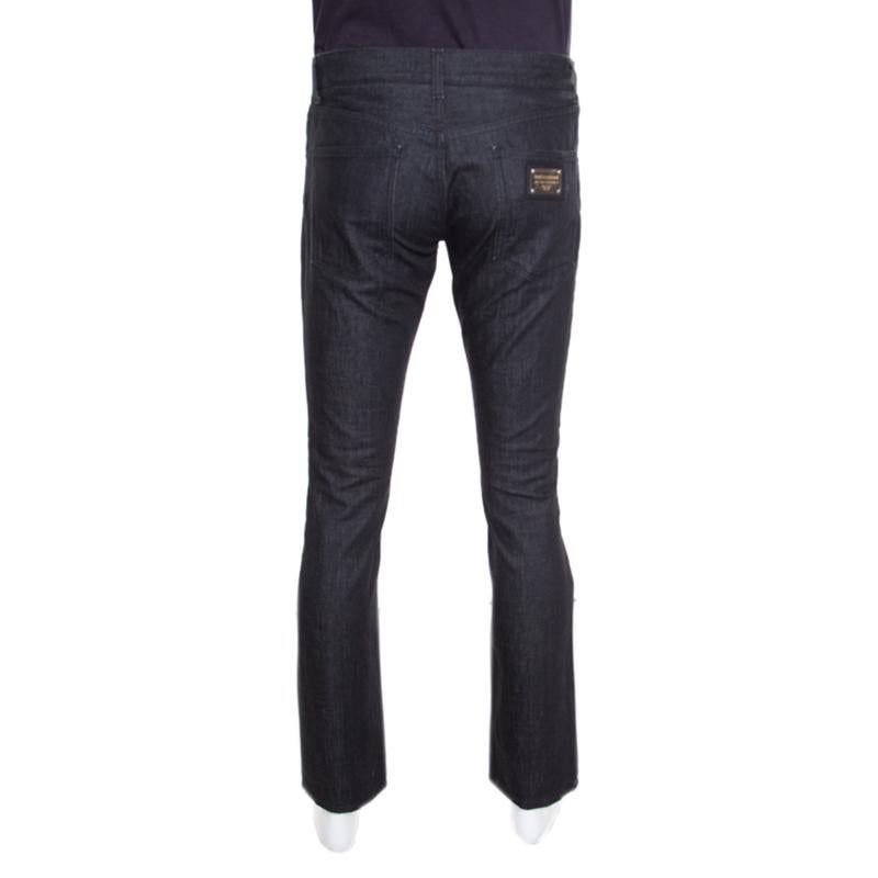 These Dolce And Gabbana denim jeans are crafted with cotton in a contemporary fashion. Designed with a black hue into a straight fitting silhouette, you can wear this versatile piece with almost anything from your polo t-shirts to casual printed