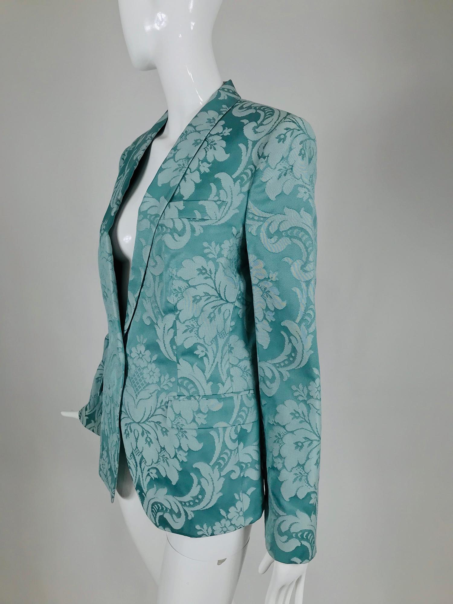 Dolce and Gabbana aqua satin jacquard brocade jacket. Single breasted, shawl collar jacket with long sleeves is fitted through the waist. The jacket has a center back hem vent and is lined inside at the shoulders and fronts, all seams are taped.