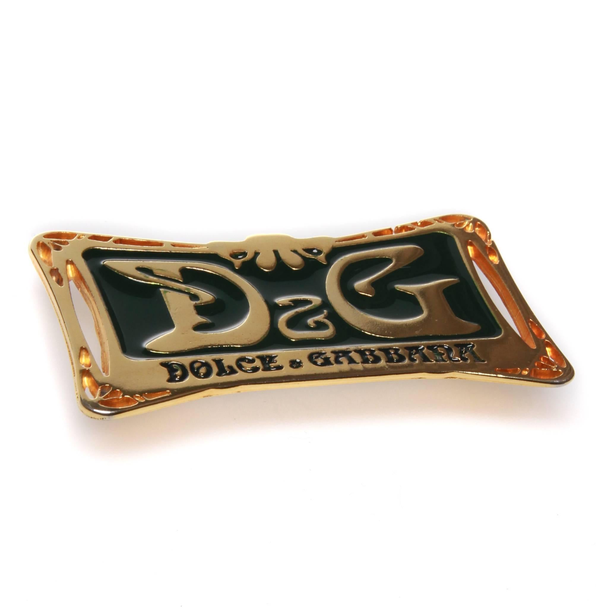 70s Dolce and Gabbana Art Deco belt buckle. Gold toned metal and green enamel. 