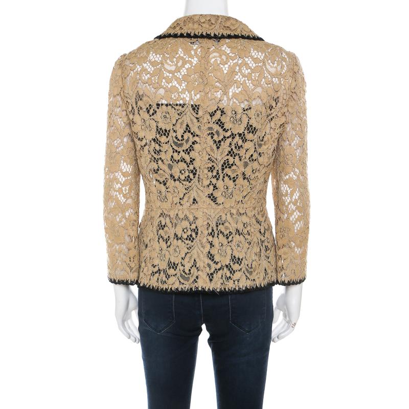 Chic, smart and stylish, this blazer is from Dolce and Gabbana! It is made of a cotton blend and features a floral lace pattern all over it. It flaunts a buttoned closure and long sleeves. Sure to lend you a great fit, it can be paired well with