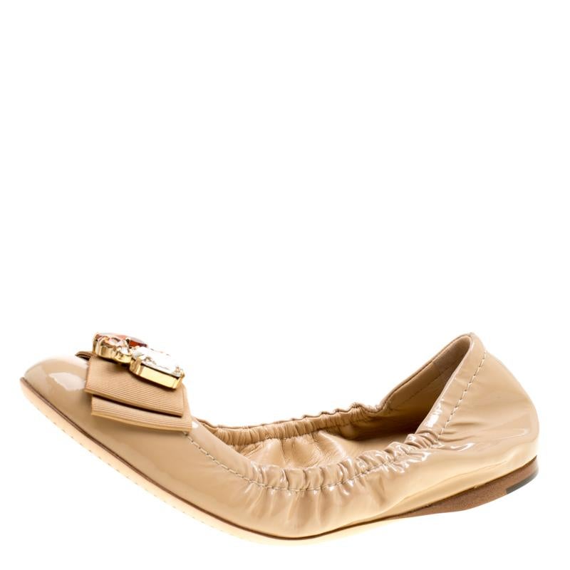 You would never want to take off these comfortable Dolce & Gabbana ballet flats. They are crafted from patent leather and designed with bows and crystals on the uppers and a scrunch style for a good fit.

Includes: Original Dustbag, Original Box

