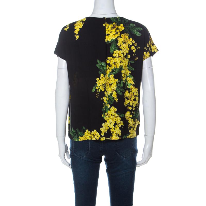 This one is an awesome piece from the house of Dolce & Gabbana. Fabulously crafted, this gorgeous top is adorned with floral Acacia prints that look accentuating on the black base. Channel a fun, feminine vibe by styling it with a solid colored
