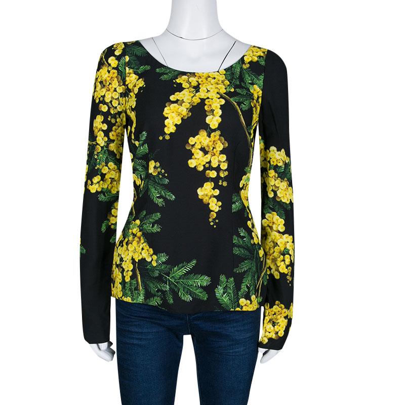 This one is an awesome piece from the house of Dolce and Gabbana. Fabulously crafted, this gorgeous top is adorned with a floral Acacia print that looks accentuating on the black base. Channel a fun, feminine vibe by styling it with a solid colored