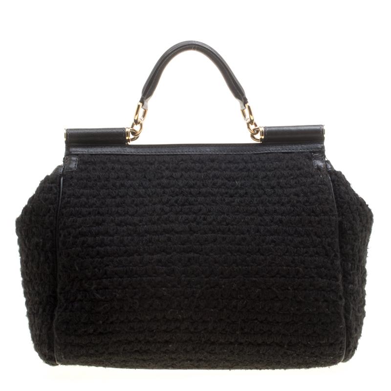 The Miss Sicily bag is one of the most celebrated creations from Dolce&Gabbana. The bag beautifully embodies the spirit of extravagance and feminity that the Italian luxury brand carries. Crafted from black fabric in a crochet design, it has a