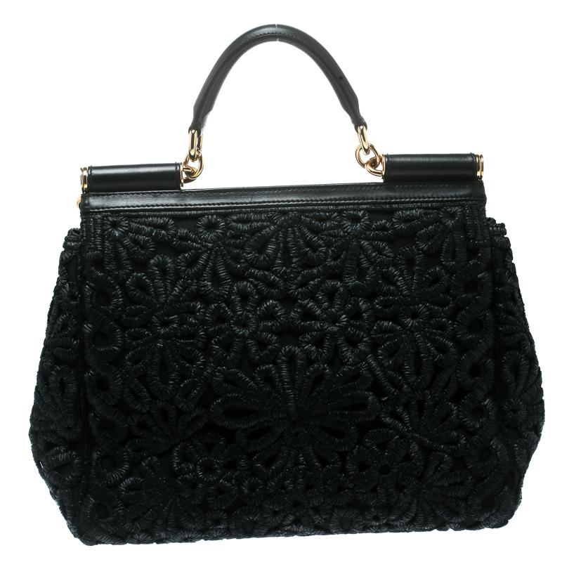 The Miss Sicily tote is one of the most celebrated creations from Dolce and Gabbana. The tote beautifully embodies the spirit of extravagance and feminity that the Italian luxury brand carries. Crafted from Raffia the bag features a Crochet design