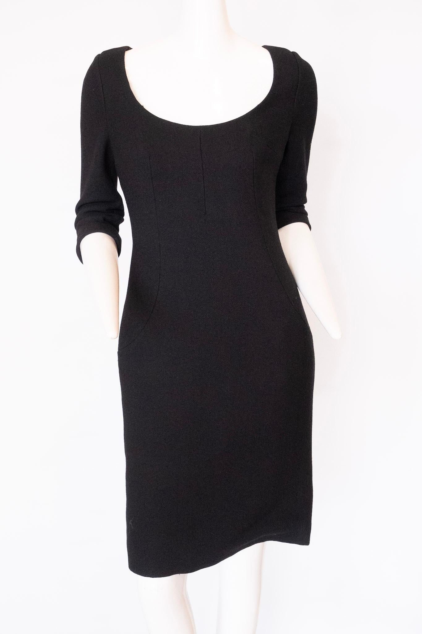 Dolce and Gabbana black sheath midi length dress with quarter length sleeves and scoop neck. 

Sz 42 / US Sz 6

Shoulder to Shoulder 17