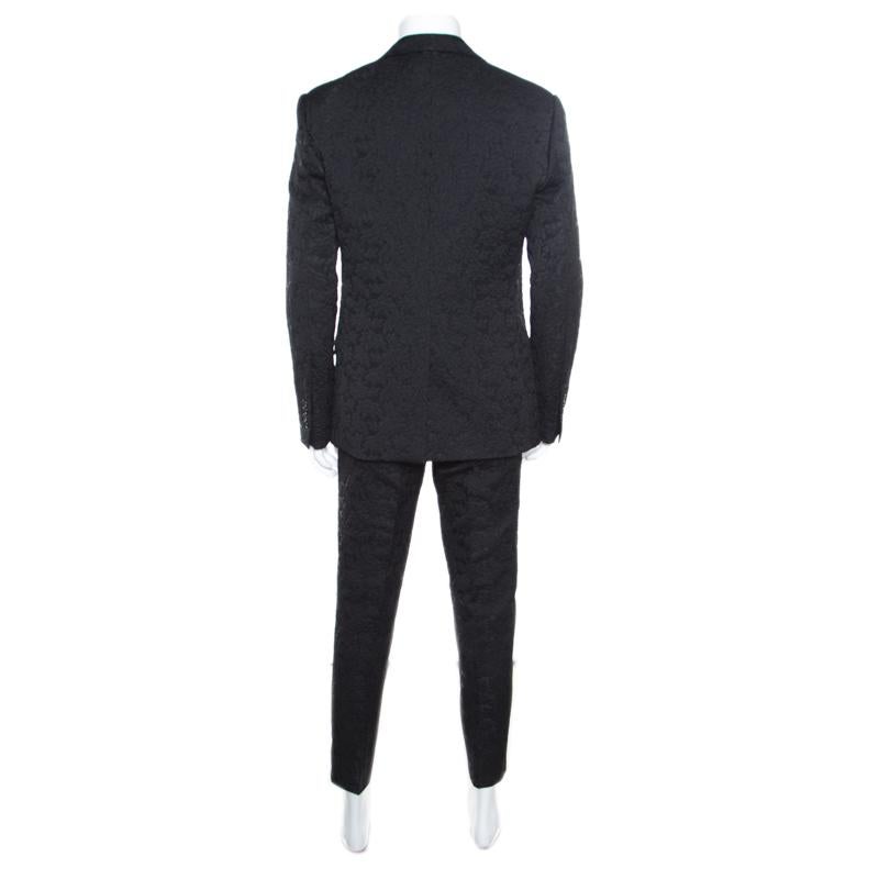Sleek and exceptionally tailored, this awesome suit from the house of Dolce and Gabbana is a great addition to your formal as well as evening wear collection. Wear it to official meetings or weddings; this suit is styled in a black blended fabric