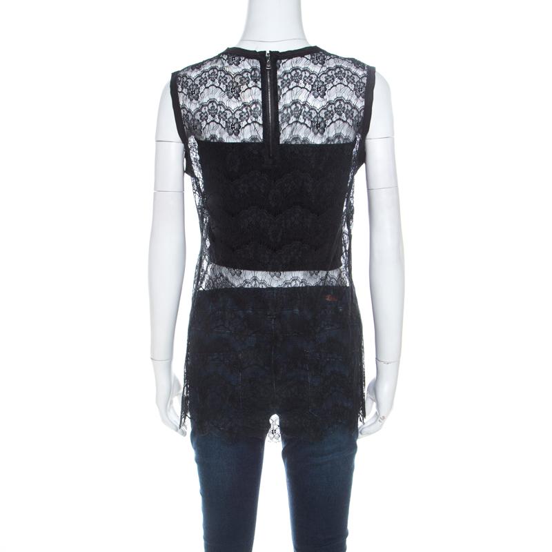 This Dolce&Gabban top is a pleasing design. The black top comes in a sheer floral lace design, joined by a round neckline and a back zipper. This sleeveless top can be worn with jeans, trousers or skirts.

Includes: The Luxury Closet Packaging

