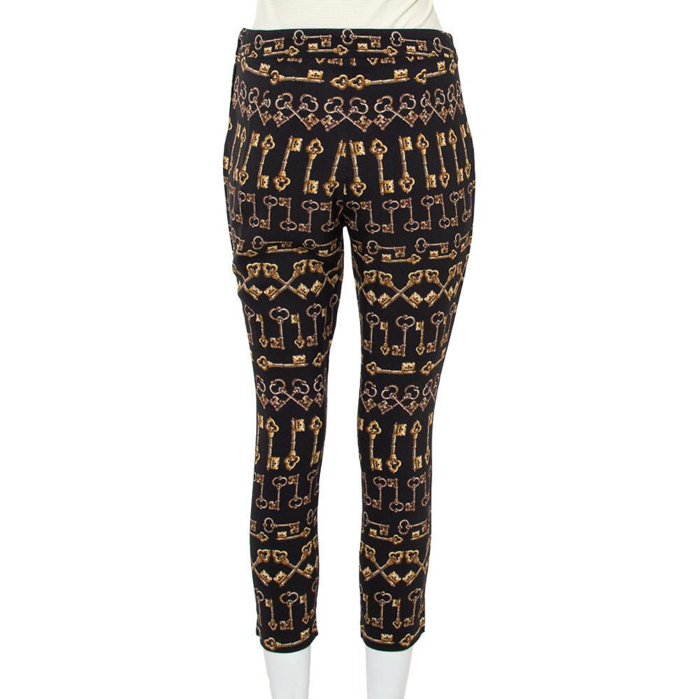 These slim-fit pants from Dolce and Gabbana are super edgy and will surely be a perfect addition to your wardrobe. Black in color, they carry a catchy key print all over. These crepe pants have been made in Italy and will be a buy you won't regret.

