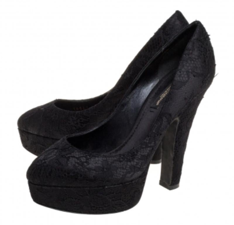This pair of pumps by Dolce and Gabbana will leave you looking like a diva. These black pumps are crafted from lace and assembled with almond toes and 12.5 cm heels supported by platforms. Add glamour to your closet by slipping into this gorgeous