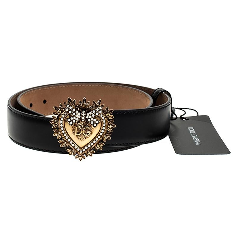 This Dolce & Gabbana belt has a magnificent Devotion heart buckle in gold-tone embellished with crystals. Crafted from durable black leather, the belt has a single loop and it will easily add a luxe touch to your ensemble.

Includes
Original