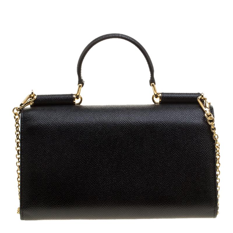 This Disco clutch is a celebrated creation by Dolce and Gabbana. It is not just elegant but utterly fashionable which is why it is so loved by fashion-forward women. This bag comes in a black hue with a structured design that features a top handle
