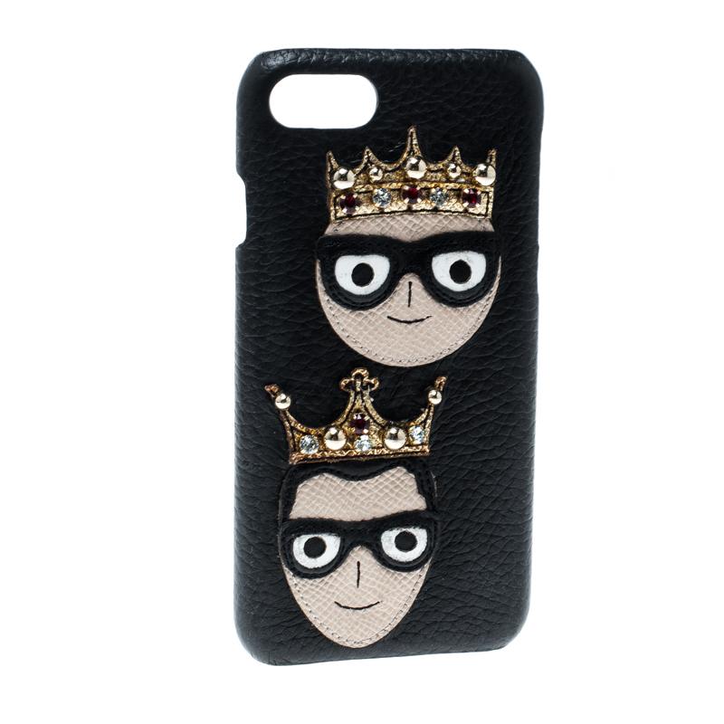 Adorned with a patch of the designer's: Domenico Dolce and Stefano Gabbana, faces with embellished crowns, this Dolce & Gabbana iPhone 7 case is crafted from leather. This black case has been created to safeguard your iPhone with style. It is handy