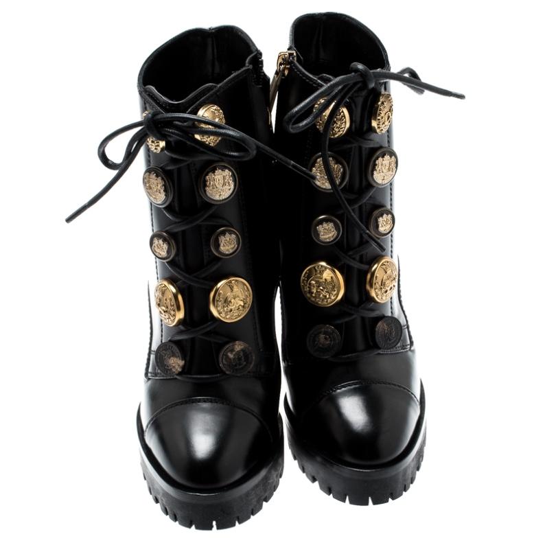 Go all out with these stylish Dolce & Gabbana boots that exude a biker chic vibe. The block heels and the button embellishments add on to the appeal of these boots. They also feature a laced front and platforms.

Includes: Original Dustbag, Original