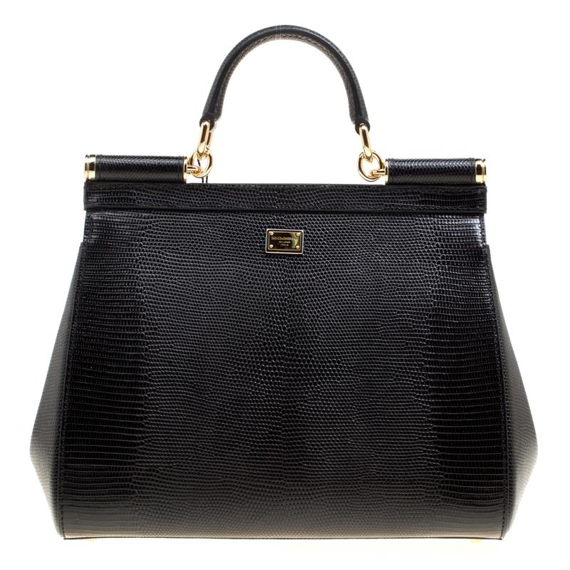 The Sicily range of bags is one of the most celebrated creations from Dolce and Gabbana. This black beauty beautifully embodies the spirit of extravagance and feminity that the Italian luxury brand carries. Crafted from leather, the bag has a