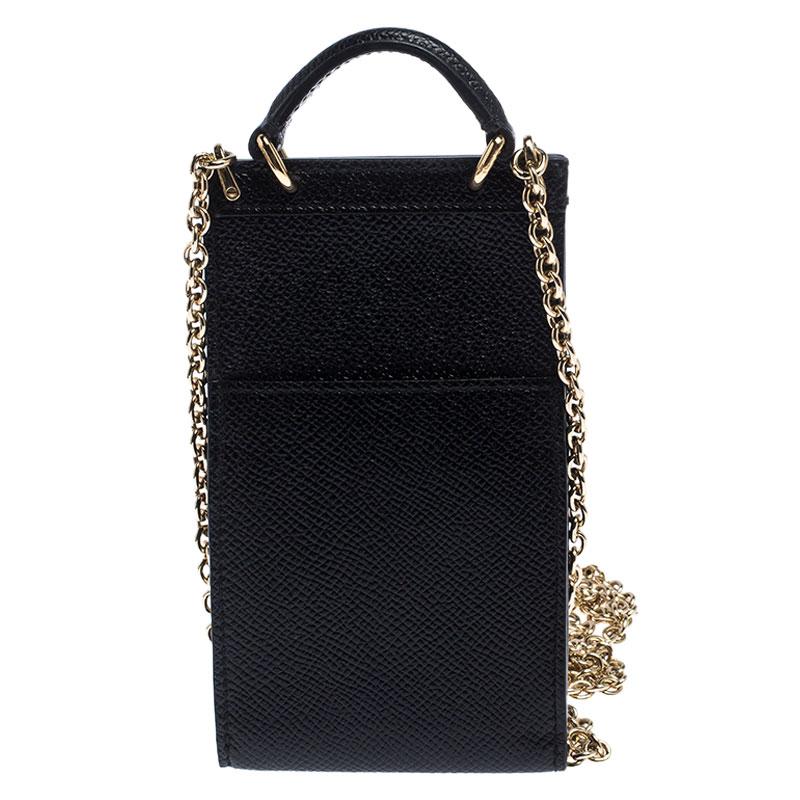 This gorgeous Black Miss Sicily crossbody bag from Dolce & Gabbana is very trendy. It has a well-structured design and a flap that opens to a compartment with leather lining and enough space to fit your phone and other essentials. The bag comes with