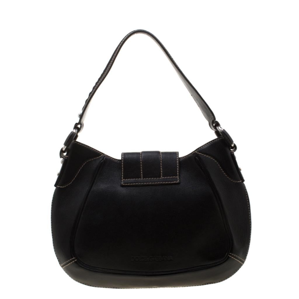 This sleek leather bag, with a fabric interior and silver-tone hardware, is luxurious enough to elevate your everyday style. The black bag is by Dolce & Gabbana and it is designed to be durable and handy.

Includes: The Luxury Closet Packaging

