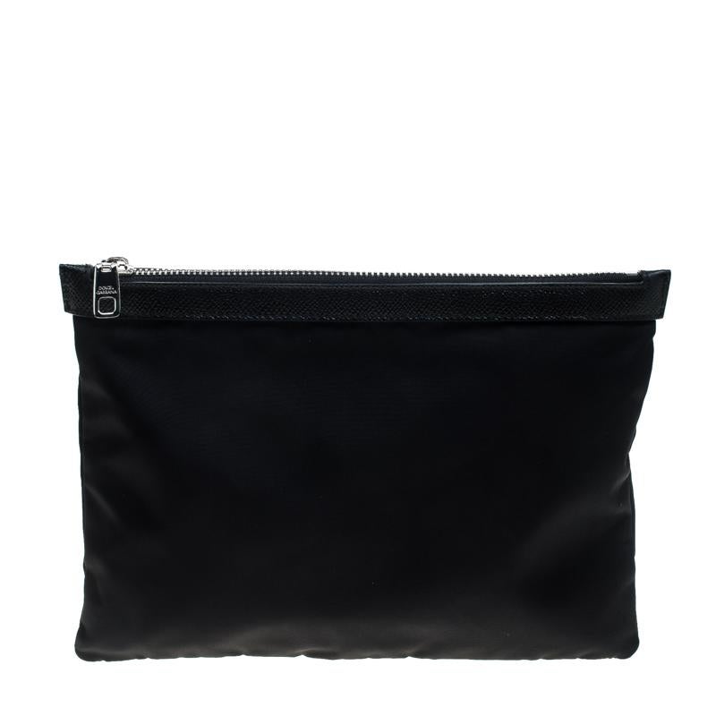 Fun and stylish, this nylon pouch will assist you with ease. An essential wardrobe accessory, this Dolce&Gabbana pouch is designed with leather trims and studs in the design of a radio and an interior secured by a zipper. It is surely a
