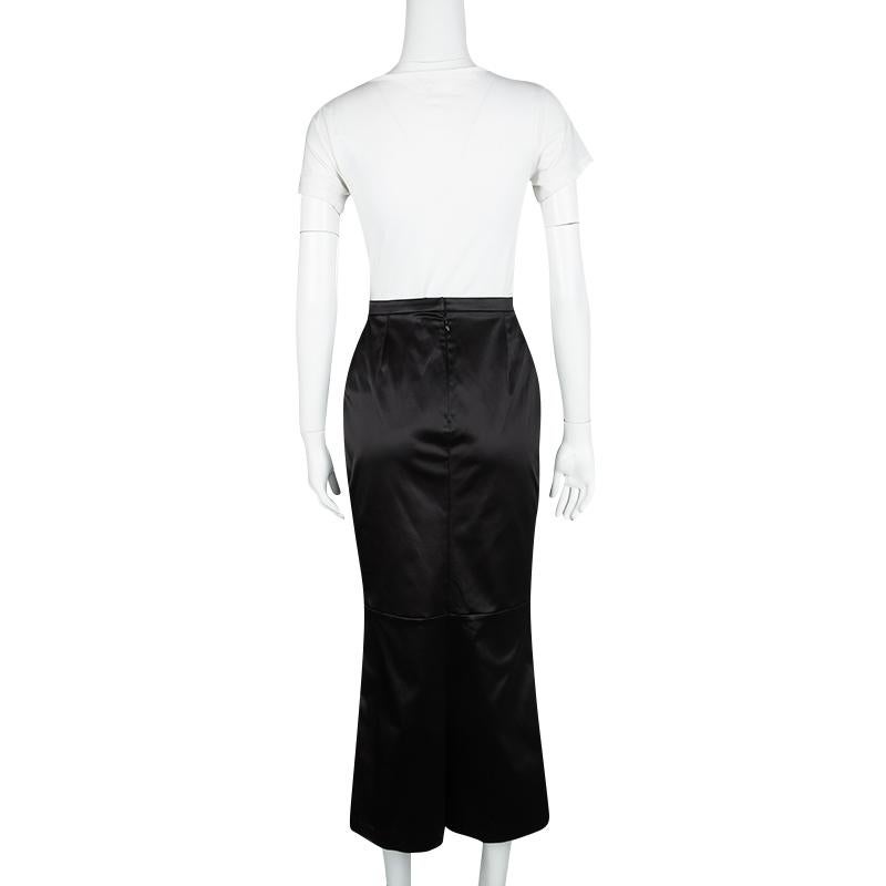 Dolce&Gabbana brings you this midi skirt that is well-made and high in style. It comes tailored from satin and designed in a black shade. You can wear it with a silk top and a pair of elegant sandals or pumps.

Includes: Packaging
