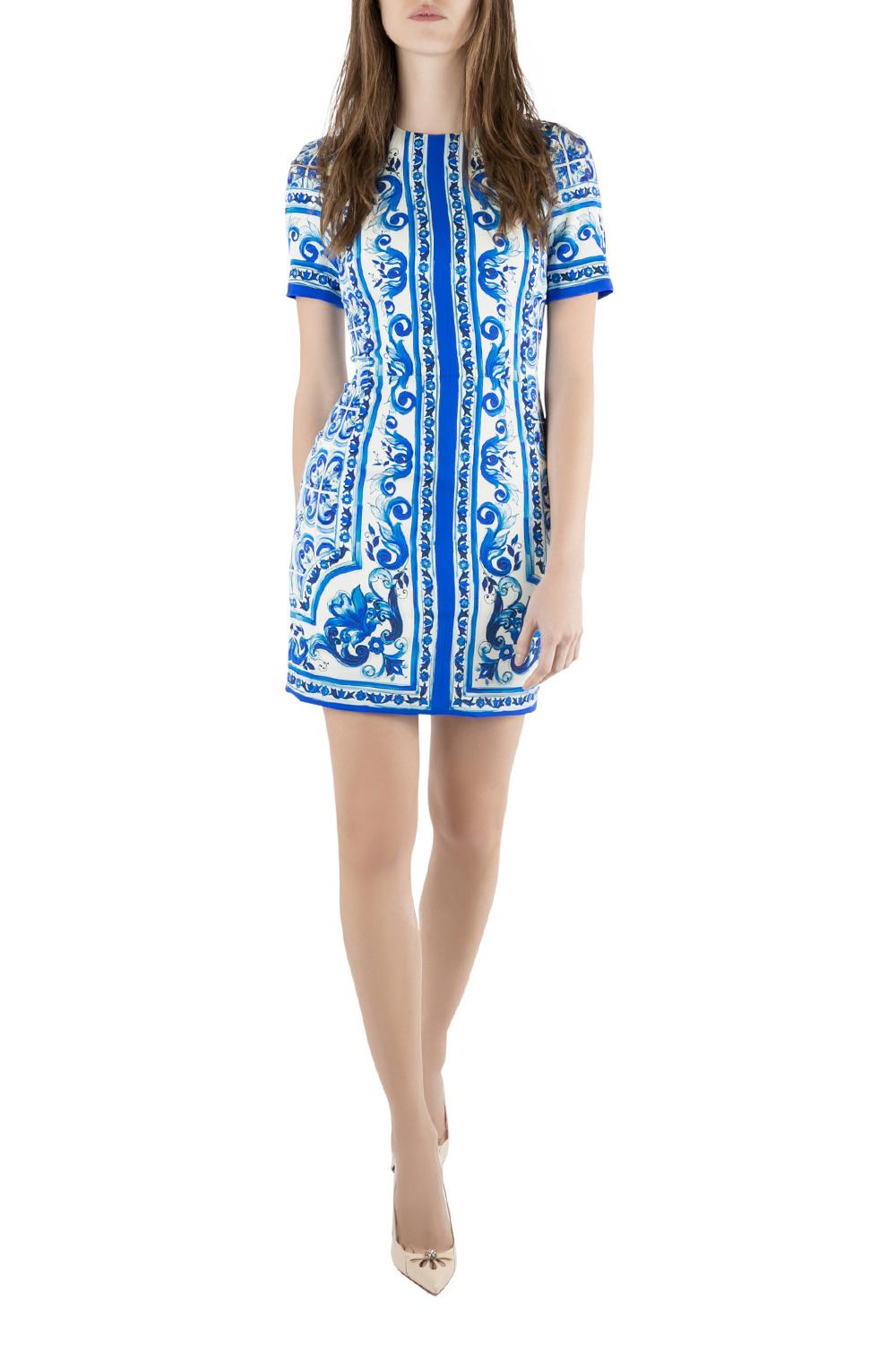 Tailored from a smooth silk blend, this fitted sheath dress is perfect for a day out or even for an evening event. The gorgeous Dolce & Gabbana creation is designed with majolica print in a combination of blue and white color. Team it with kitten