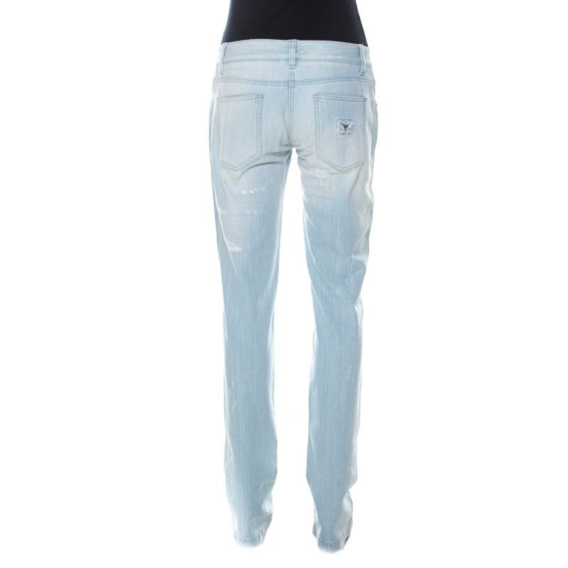 Wear these blue jeans from Dolce and Gabbana on days when you wish to dress casually. Made of a cotton blend, they've been tailored in a straight-leg shape and embellished with crystals. You must try wearing it with a halter top and block heel