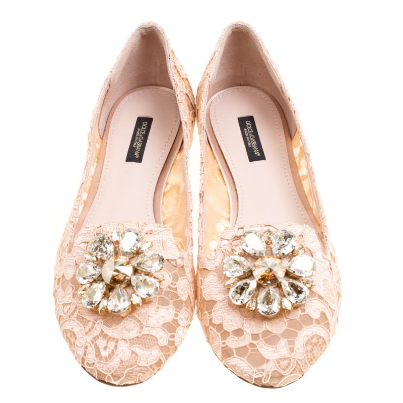 Classy and very stylish, these blush pink-colored ballet flats from Dolce and Gabbana are worth every penny you spend! They are crafted from lace and mesh and feature a large, crystal embellishment on the vamps. They come fitted with mesh-lined