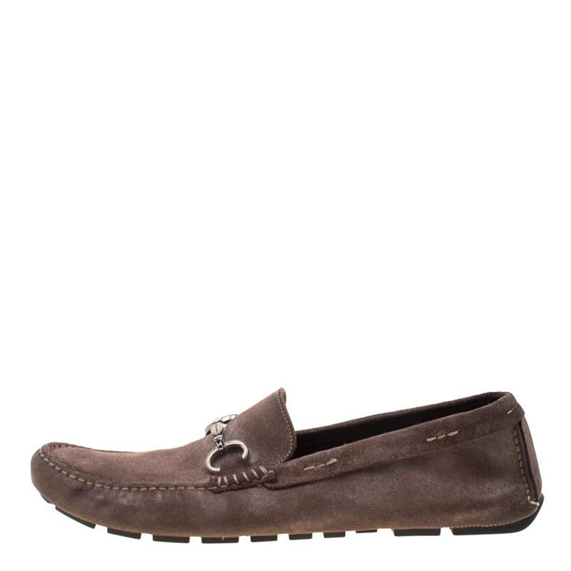 Stylish and super comfortable, this pair of loafers by Dolce & Gabbana will make a great addition to your shoe collection. They have been crafted from antique finish suede and styled with metal motifs on the uppers. Leather insoles and rubber
