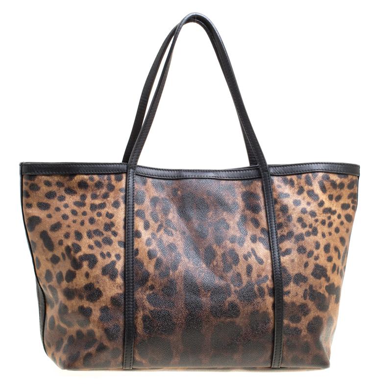 You know what would be the perfect tote to swing for your daily errands or sprees? This one here from Dolce&Gabbana. It is perfect! Crafted from leopard-printed canvas, the bag has a lovely shape, two leather handles and a spacious fabric