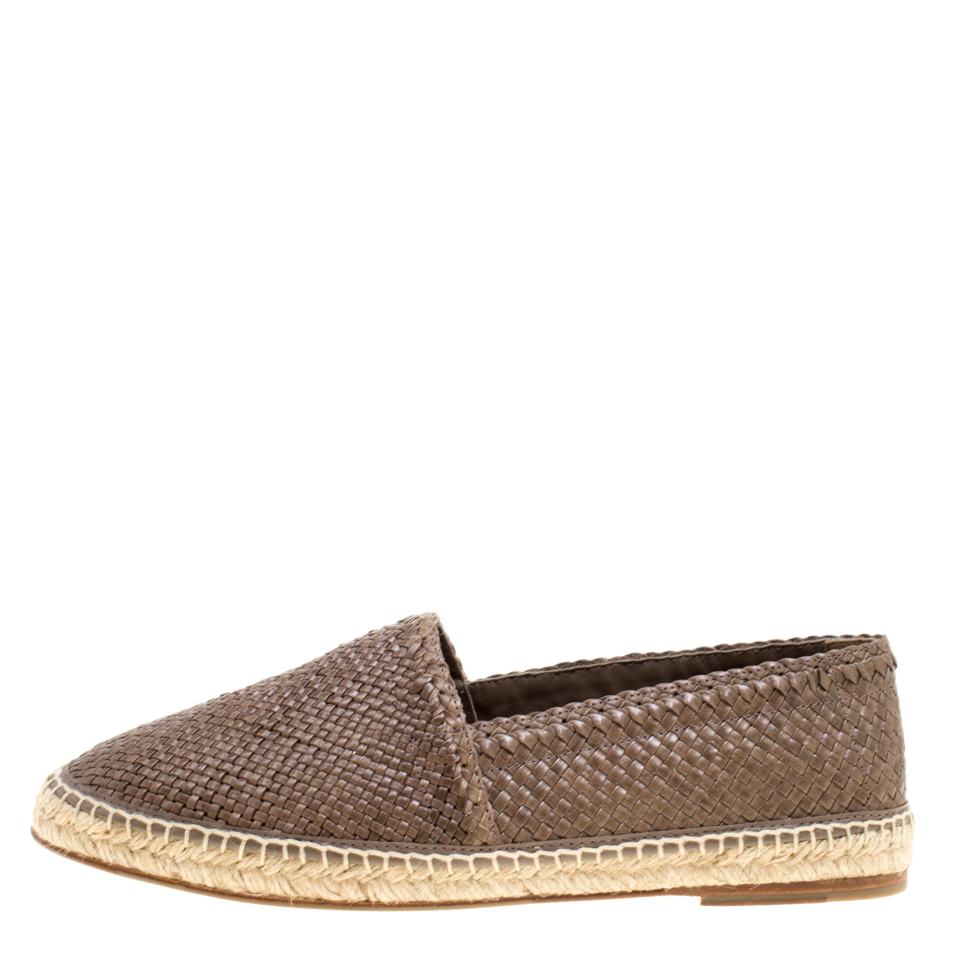 Espadrilles are not just stylish, but also comfortable and easy to wear. This lovely pair of Dolce & Gabbana espadrilles will accompany a casual outfit with perfection. They have been formed by braiding brown leather and finishing them with braided