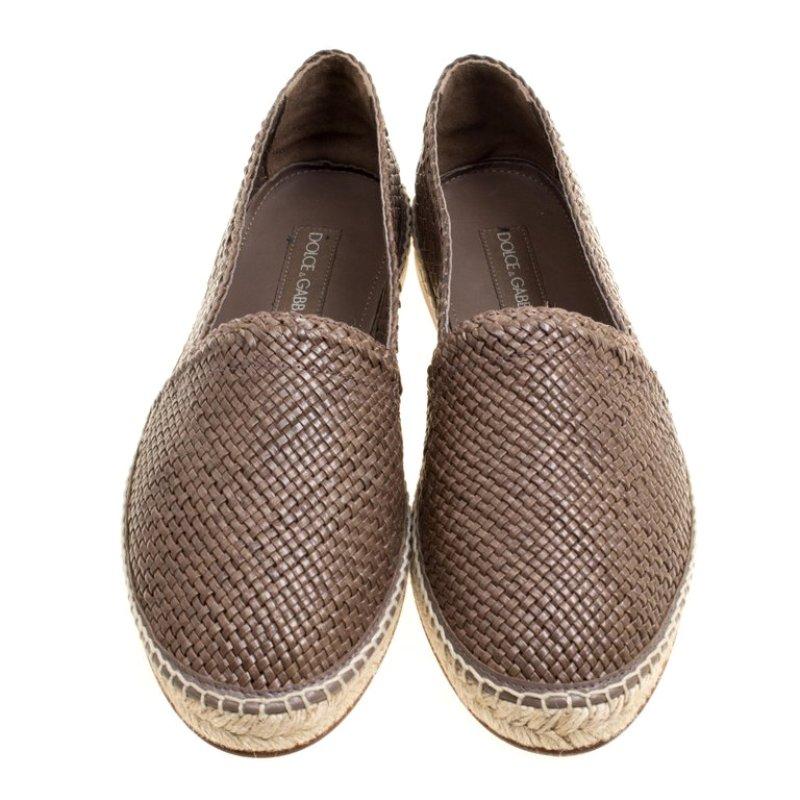 Espadrilles are not just stylish, but also comfortable and easy to wear. This lovely pair of Dolce & Gabbana espadrilles will accompany a casual outfit with perfection. They have been formed by braiding brown leather and finishing them with braided