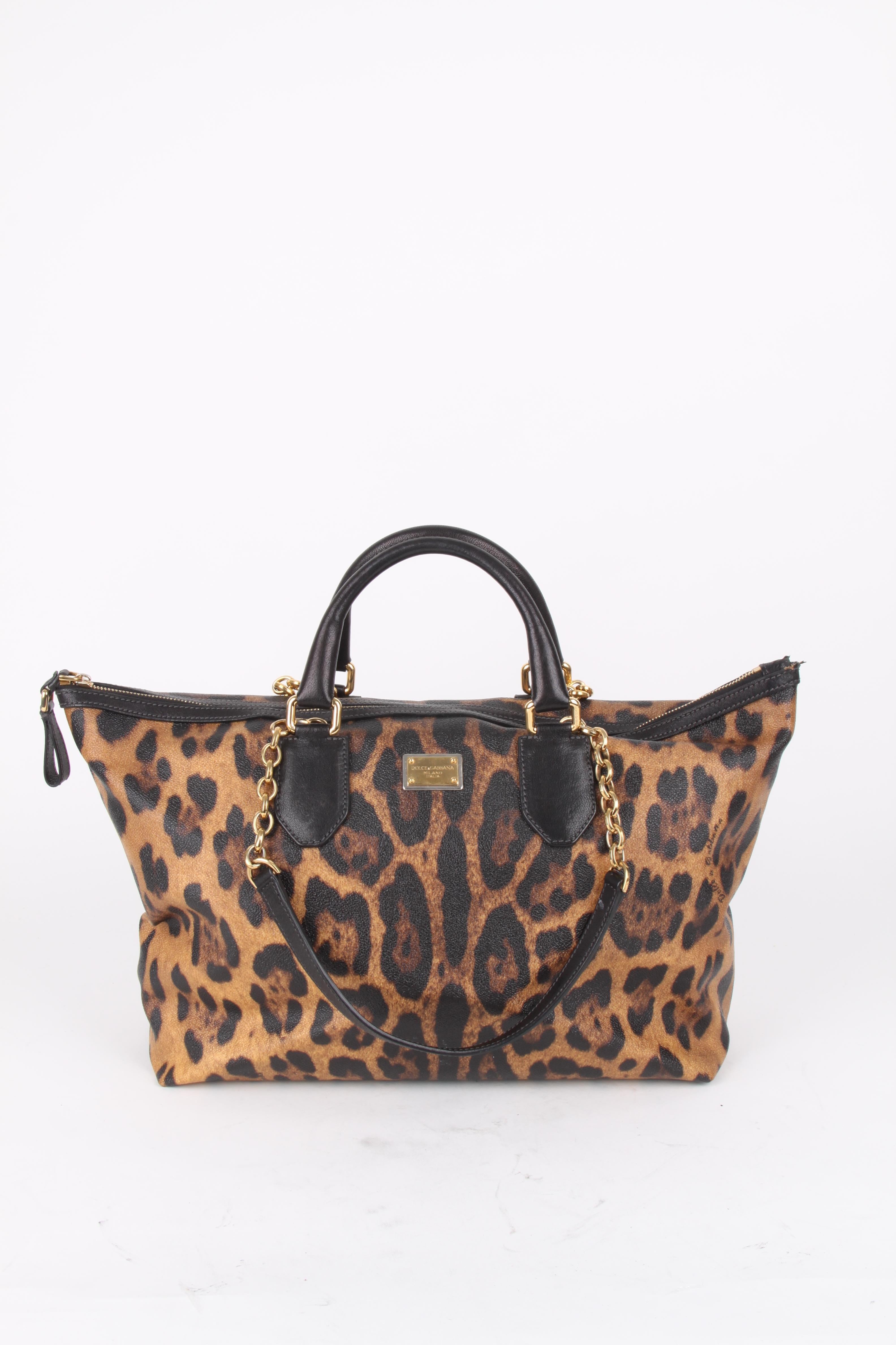 Dolce and Gabbana Brown Canvas Leather Leopard Print Handbag.

This little bag makes a big statement. It features a canvas exterior with matching brown leather handles. The bag features a black cotton lining, zipper closure, one main compartment and