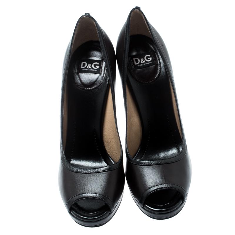 These pumps from Dolce & Gabbana will be ideal for workwear or for other occasions. They are crafted from brown leather and feature peep toes and 13 cm heels. The pumps are well-made and easy to flaunt.

Includes: Branded Box


