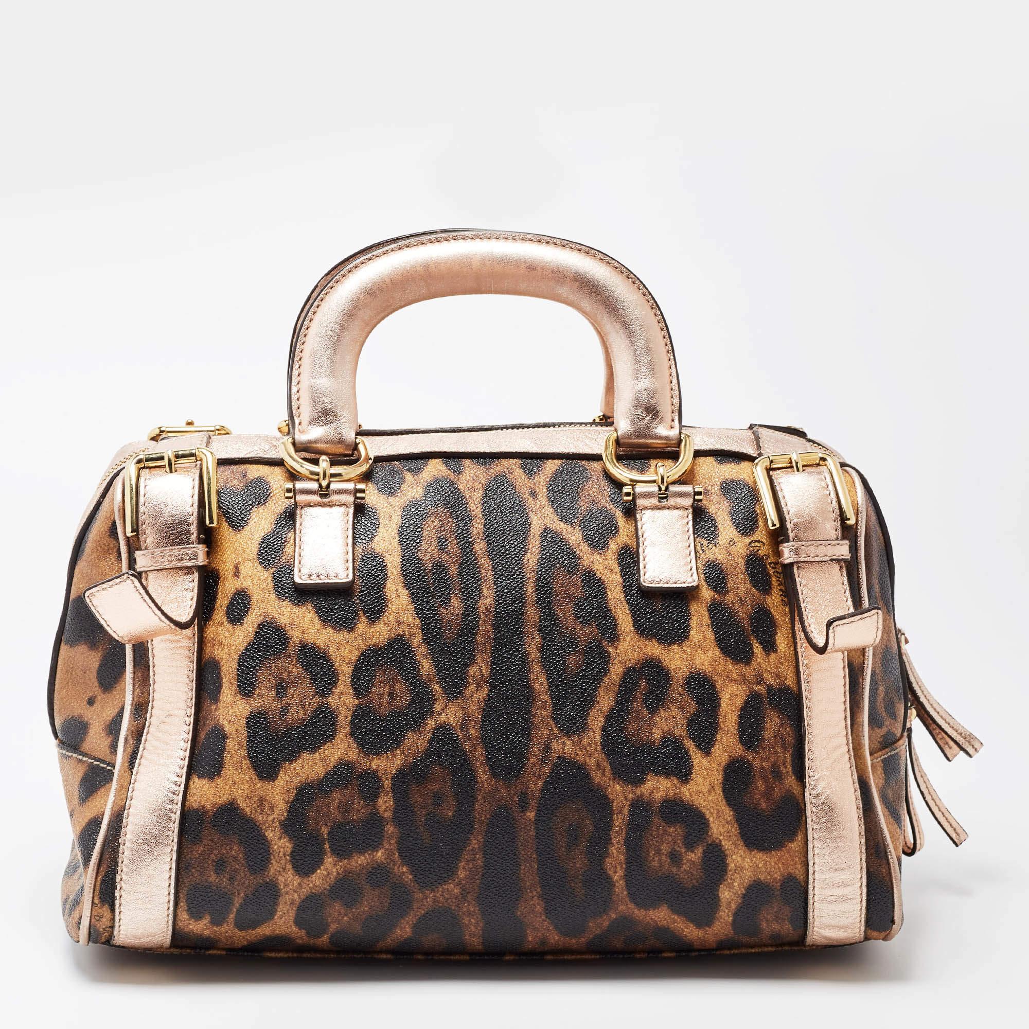 A spacious storage that can hold all that you need through the day, this Dolce and Gabbana Miss Easy Way satchel will look chic and stylish with a versatile function for everyday use. Crafted in brown leopard printed coated canvas, this bag is