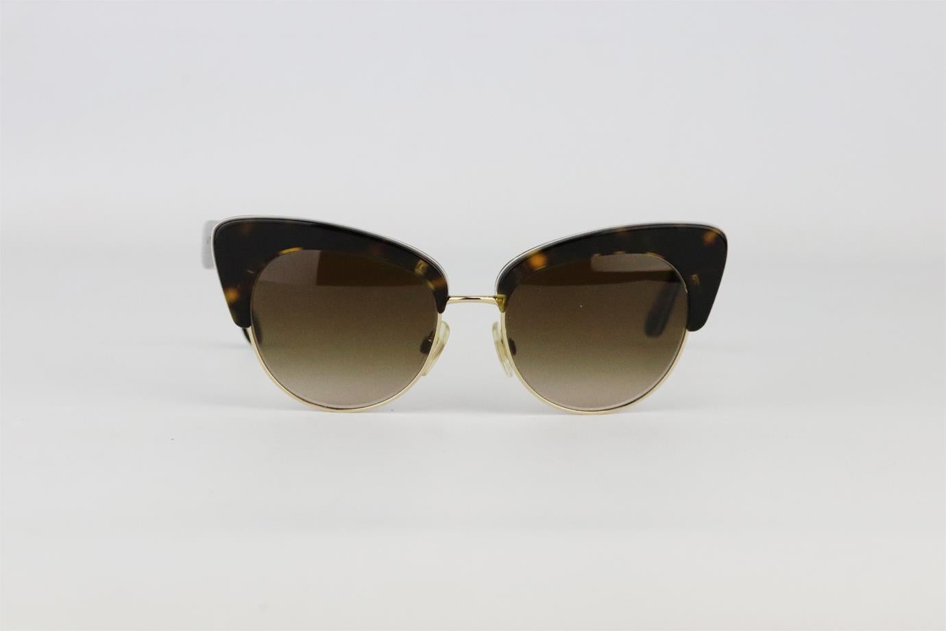 Dolce & Gabbana cat eye tortoiseshell acetate sunglasses. Made in brown tortoiseshell in a butterfly shape that gives them a vintage feel. Brown. Comes with box and case. Lens: 52 mm. Arm: 140 mm. Bridge: 17 mm
