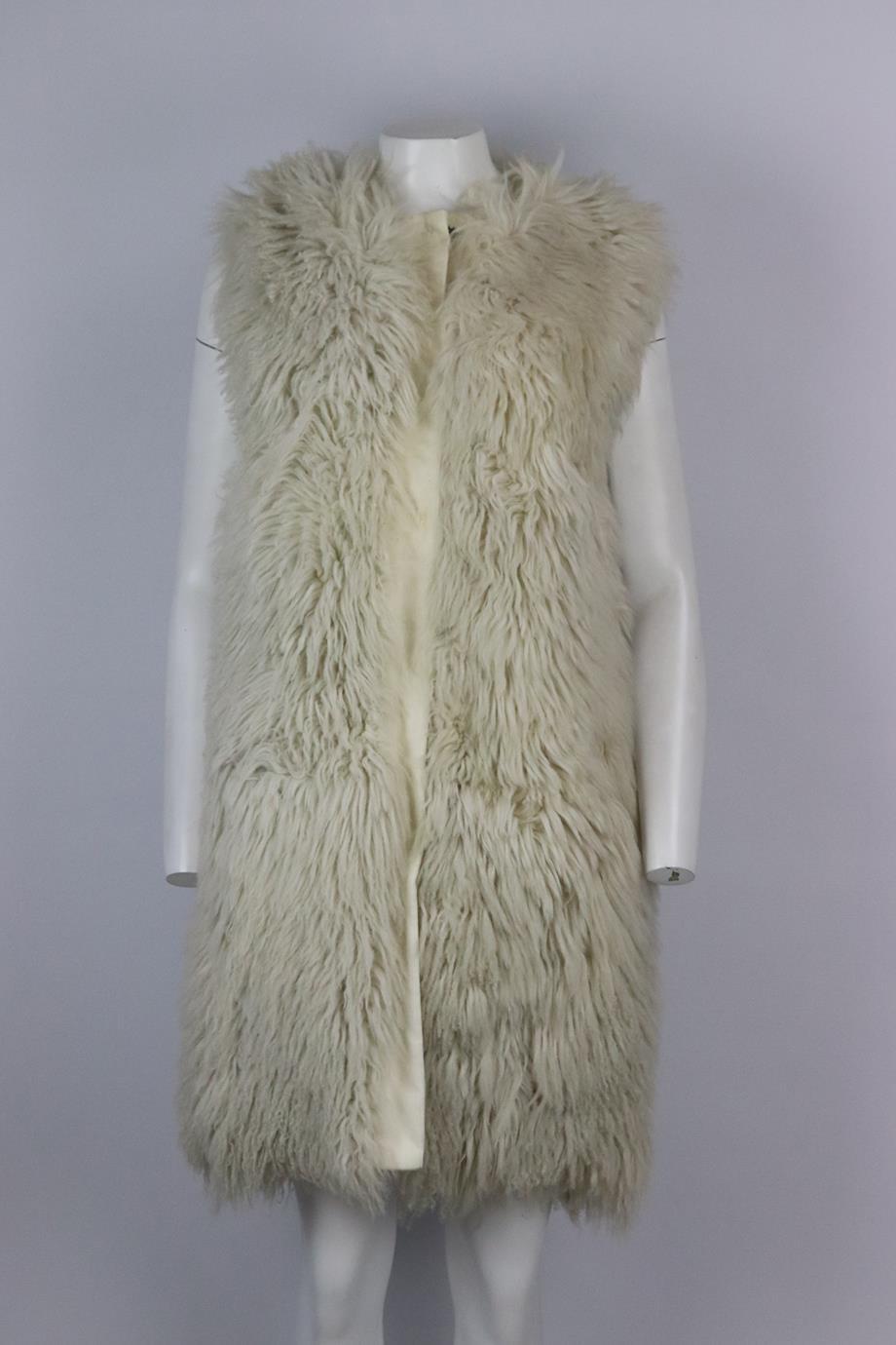 Dolce & Gabbana corduroy trimmed shearling gilet. Ecru. Sleeveless, crewneck. Snap button fastening at front. 100% Leather. Size: IT 40 (UK 8, US 4, FR 36). Bust: 40 in. Waist: 41 in. Hips: 42 in. Length: 38 in. Fair condition - Discoloured