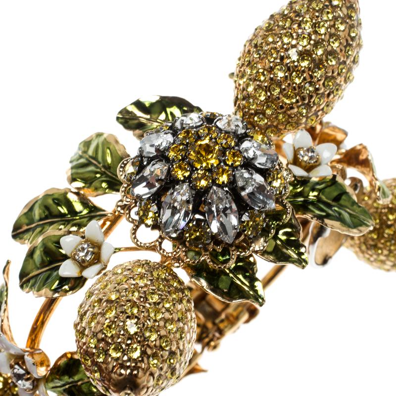 Presenting a vision of wrapping a glamorous vine from the garden of luxury around your wrist is this creation from Dolce&Gabbana. Made excellently from gold-tone metal, the bracelet has an assembly of leaves, crystal-covered lemon appliques as well