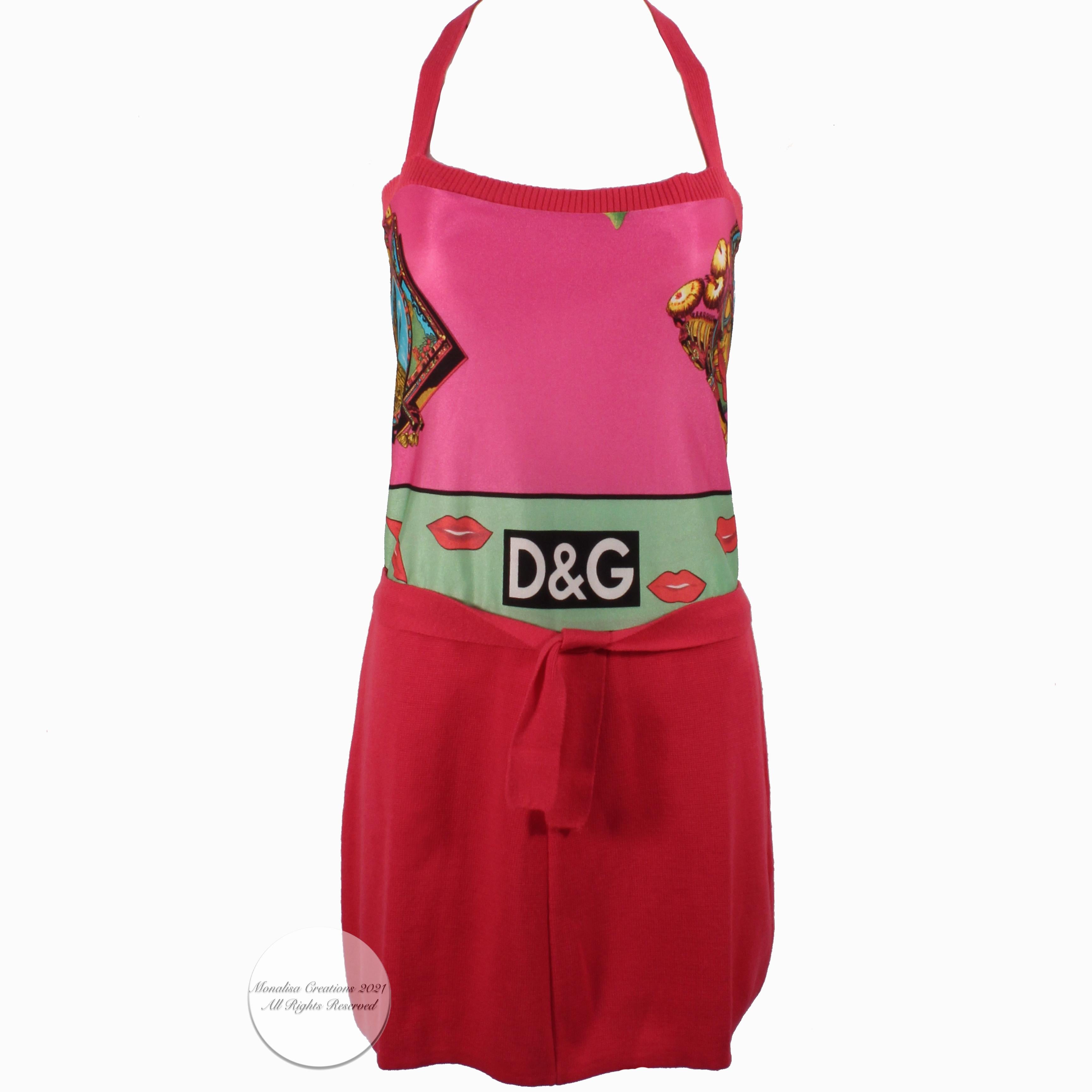 Preowned Dolce and Gabbana satin and knit halter dress, made for their D&G label.  Made from an acrylic satin fabric with graphic print, the ties, skirt and trim are made from a carnation pink cotton knit.  Great little dress that travels well (easy