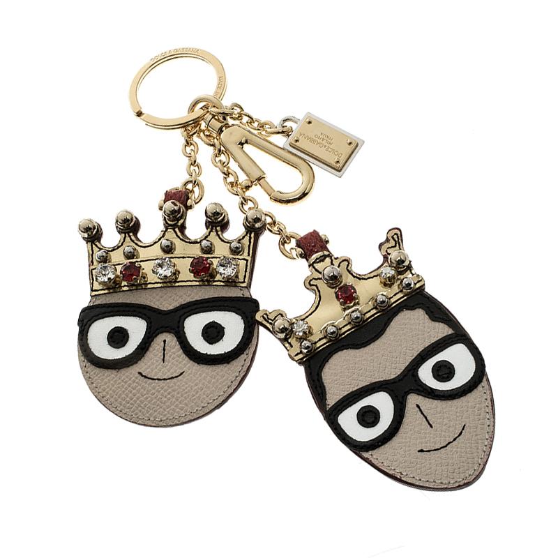 Fun and quirky, this Dolce and Gabbana is the best way to tell the world how big a fan you are of the brand. It features two cute face charms of the designers in leather detailed with crystal embellished crowns on them. It comes with gold tone chain