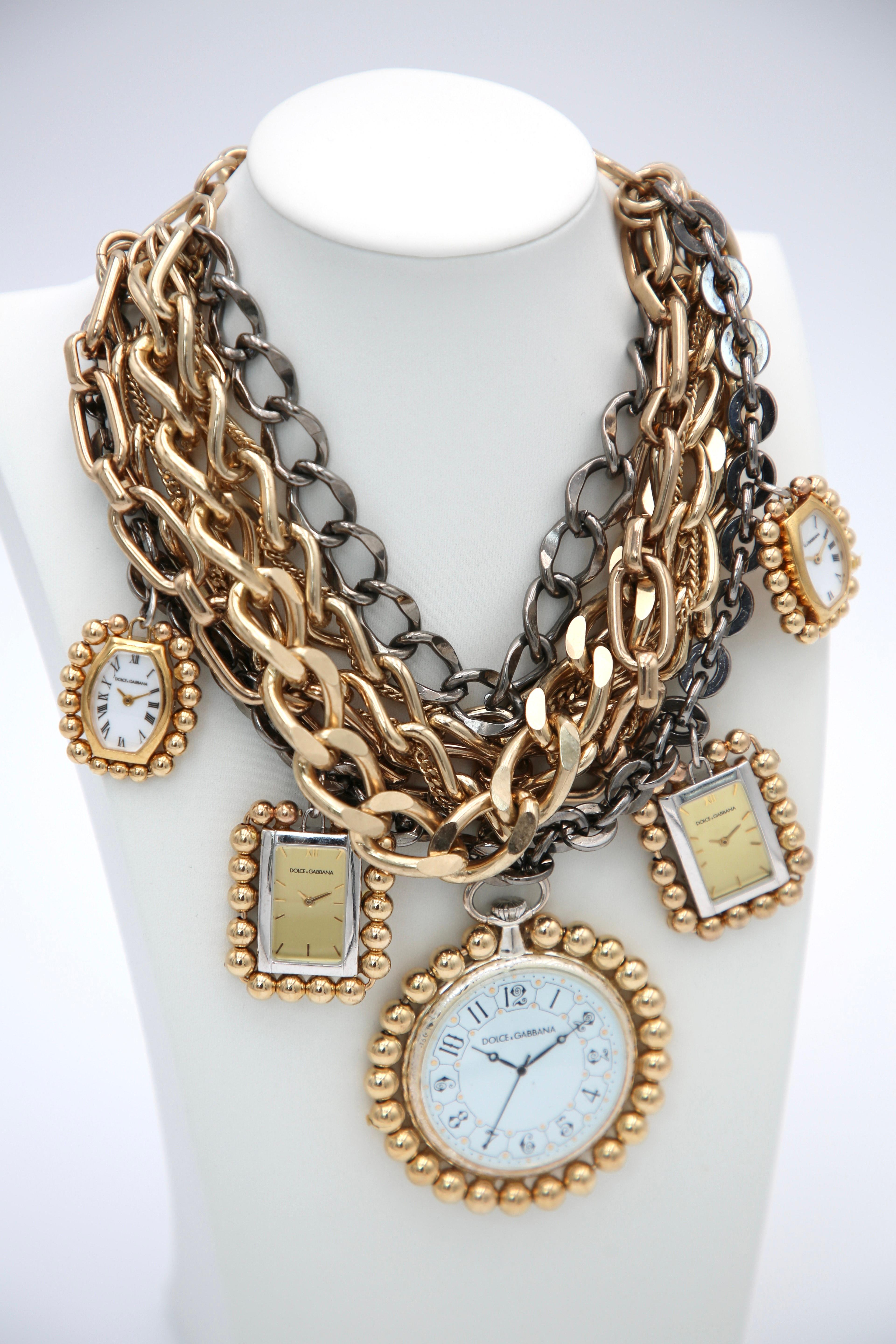 Dolce and Gabbana Fall 2009 Watch Necklace. In their Fall 2009 Ready to Wear collection, Dolce & Gabbana showcased an array of opulent jewelry pieces, including gold watch necklaces that exemplified the brand's luxurious aesthetic. These necklaces